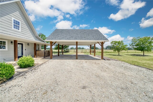 view of patio featuring driveway and a carport