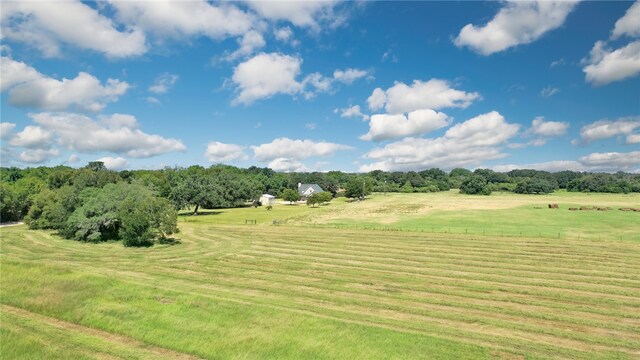 exterior space with a lawn and a rural view