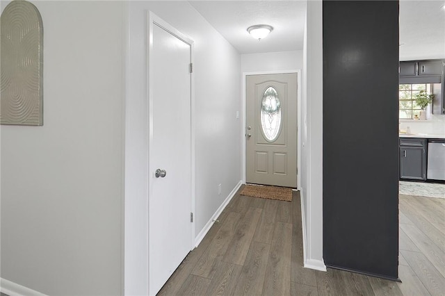 doorway with light hardwood / wood-style floors