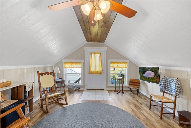 1858 Valley View Dr, Anderson, TX 77830 - sitting room featuring wood finished floors, healthy amount of natural light, lofted ceiling, ceiling fan, and wood walls