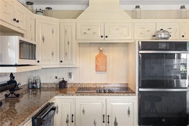 1858 Valley View Dr, Anderson, TX 77830 - kitchen with black appliances and dark stone countertops