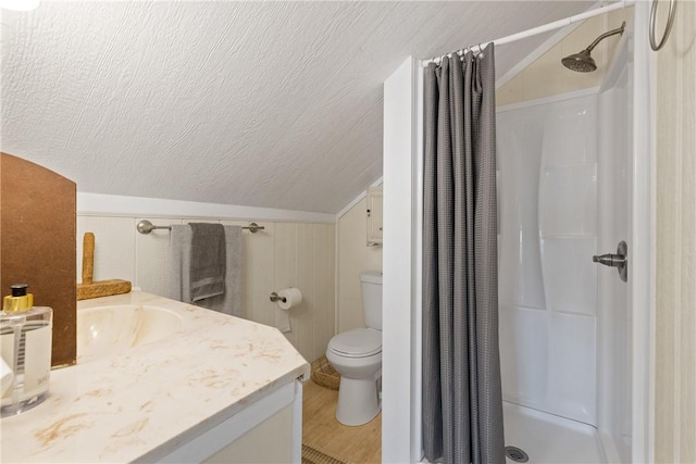 1858 Valley View Dr, Anderson, TX 77830 - full bathroom with vaulted ceiling, a shower with curtain, vanity, toilet, and a textured ceiling
