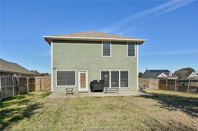 rear view of house with a patio area and a yard