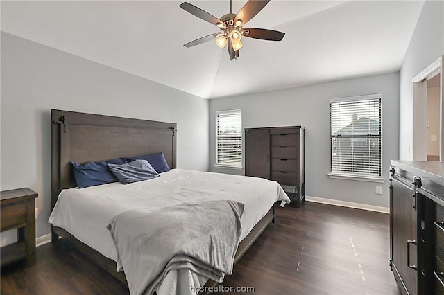 bedroom with multiple windows, ceiling fan, dark hardwood / wood-style floors, and lofted ceiling