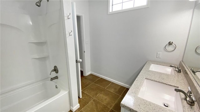 bathroom featuring tile patterned flooring, vanity, and shower / bathtub combination