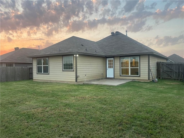 833 Mockingbird St, Navasota, TX 77868 - back of property with a patio area and a shingled roof