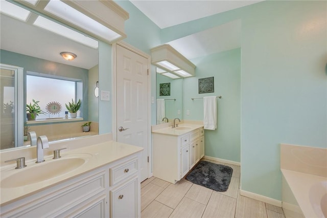 bathroom featuring vanity and a bathing tub