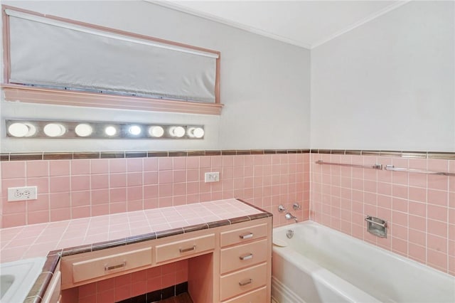 bathroom with a tub to relax in and tile walls