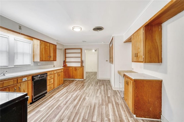 kitchen with dishwasher, crown molding, sink, light hardwood / wood-style flooring, and decorative backsplash