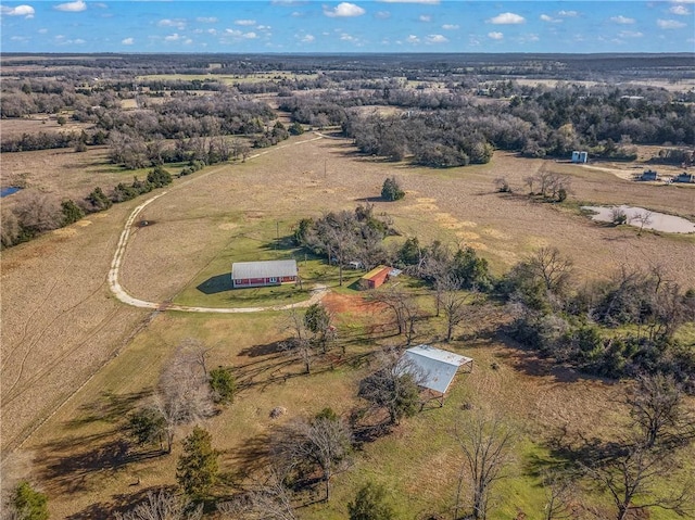 birds eye view of property with a rural view