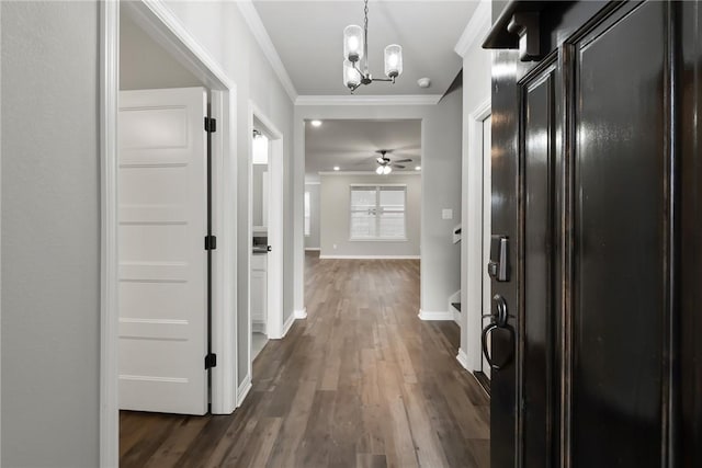 6434 Raleigh Loop, College Station, TX 77845 - corridor featuring ornamental molding, dark wood-type flooring, and a chandelier