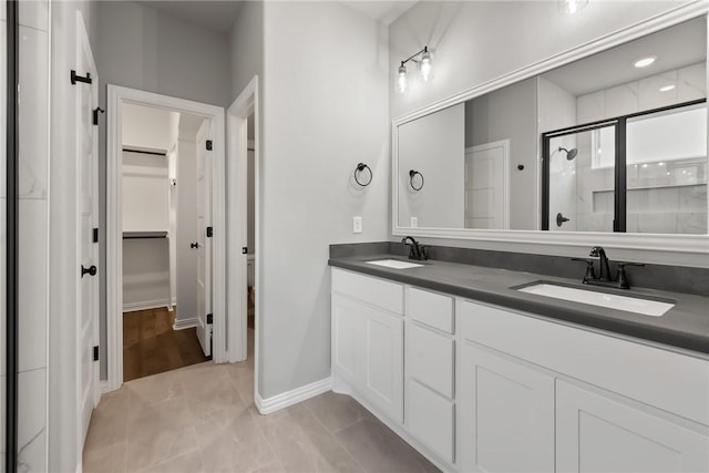6434 Raleigh Loop, College Station, TX 77845 - full bath featuring a stall shower, a spacious closet, and double vanity