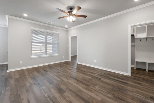 6434 Raleigh Loop, College Station, TX 77845 - unfurnished bedroom with a walk in closet, crown molding, dark wood finished floors, recessed lighting, and a ceiling fan