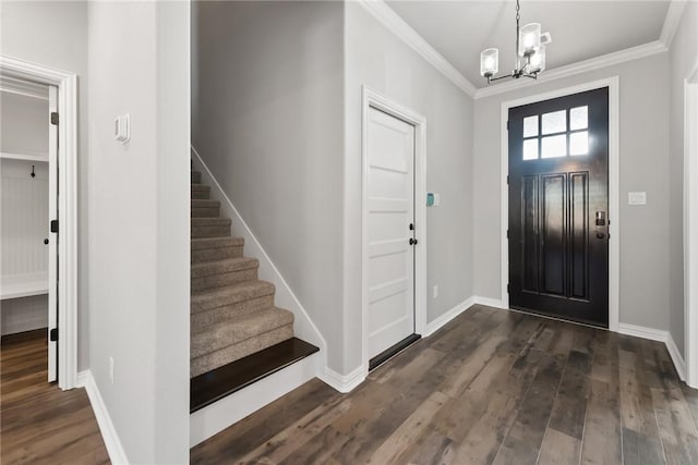 6434 Raleigh Loop, College Station, TX 77845 - foyer entrance with a chandelier, ornamental molding, dark wood finished floors, and stairway