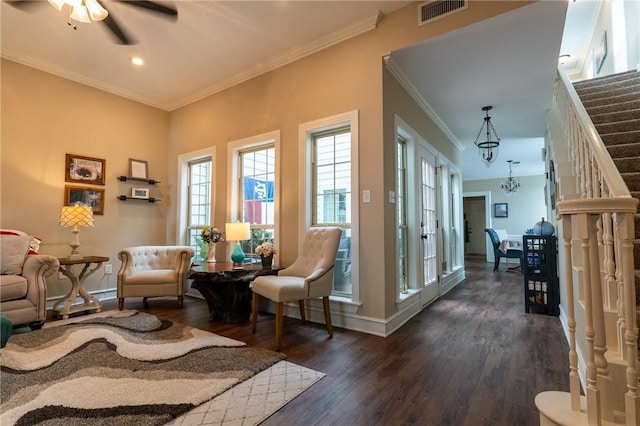 sitting room featuring ceiling fan, dark hardwood / wood-style flooring, and crown molding