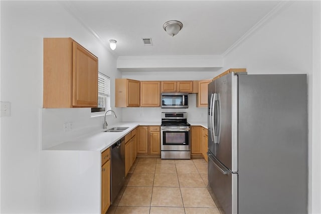 kitchen with crown molding, appliances with stainless steel finishes, sink, and light tile patterned floors