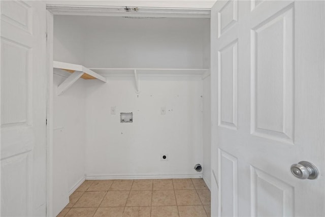 clothes washing area featuring light tile patterned floors, hookup for a washing machine, and electric dryer hookup