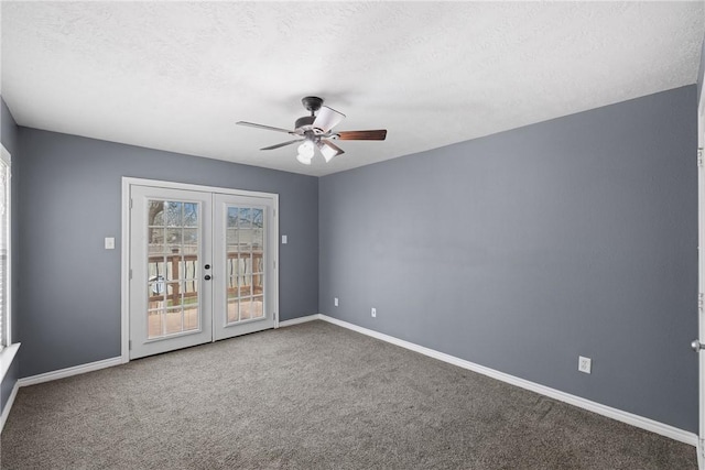 spare room with ceiling fan, carpet flooring, a textured ceiling, and french doors