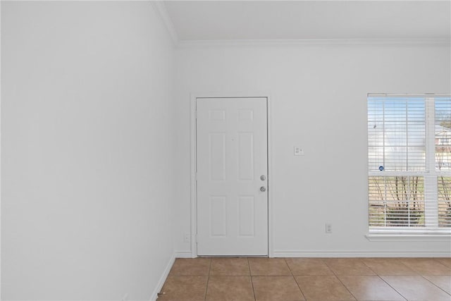 tiled spare room with crown molding