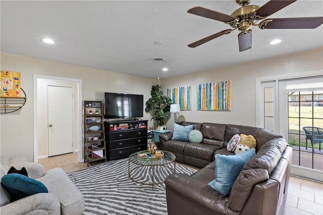 living room featuring light tile patterned floors, visible vents, recessed lighting, and a ceiling fan