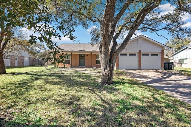 ranch-style house featuring brick siding, a garage, driveway, and a front yard