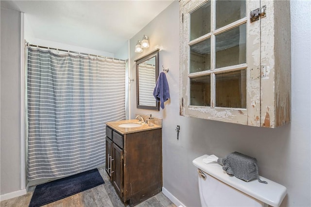 1103 Edgewood Dr, Bryan, TX 77802 - full bath featuring vanity, wood finished floors, and curtained shower