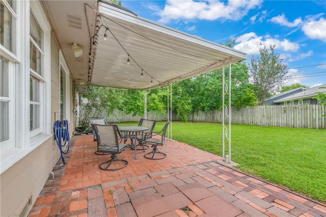 1103 Edgewood Dr, Bryan, TX 77802 - fenced backyard with a patio and outdoor dining space