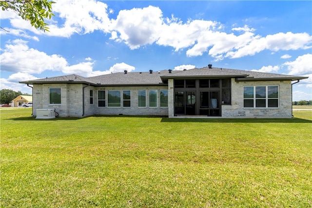 10724 Harvey Ranch Rd, College Station, TX 77845 - rear view of property with a lawn, stone siding, and a sunroom