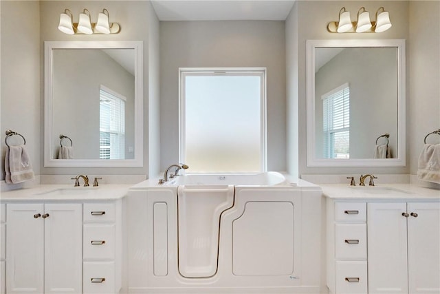10724 Harvey Ranch Rd, College Station, TX 77845 - full bath featuring plenty of natural light, two vanities, and a bath