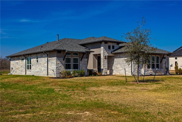 view of front facade featuring stone siding and a front lawn