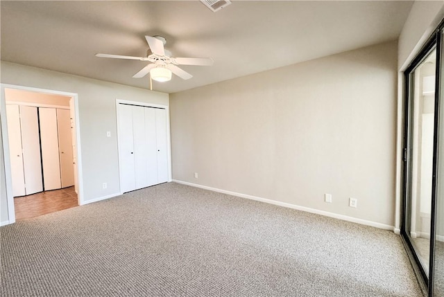 1406 Broken Hls Unit 14, Horseshoe Bay, TX 78657 - unfurnished bedroom with carpet flooring, baseboards, and a ceiling fan