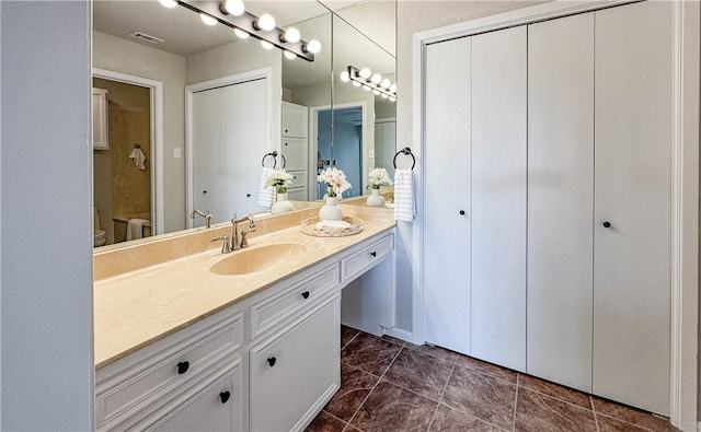 1406 Broken Hls Unit 14, Horseshoe Bay, TX 78657 - bathroom featuring vanity and toilet