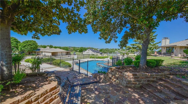 1406 Broken Hls Unit 14, Horseshoe Bay, TX 78657 - view of swimming pool with a patio