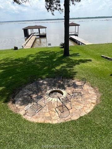 231 Memphis Belle Ln, Trinity, TX 75862 - dock with a water view and an outdoor fire pit
