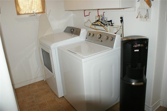 231 Memphis Belle Ln, Trinity, TX 75862 - clothes washing area featuring washer and dryer and baseboards