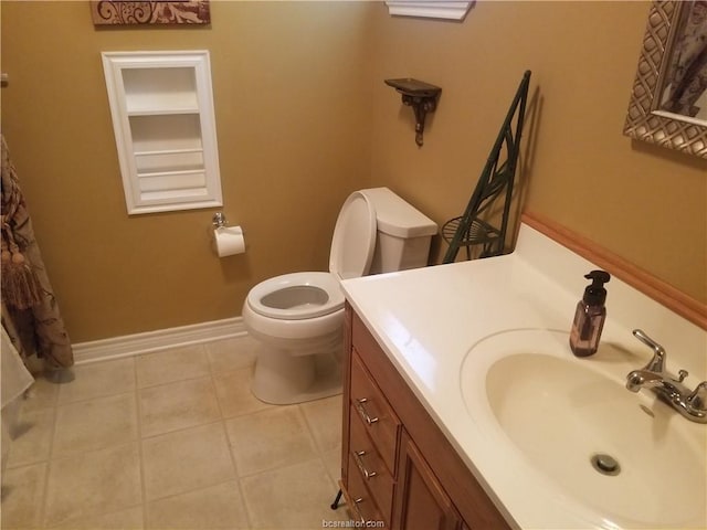 231 Memphis Belle Ln, Trinity, TX 75862 - bathroom with toilet, vanity, tile patterned flooring, and baseboards