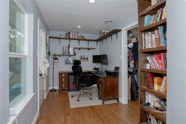 office with light hardwood / wood-style floors