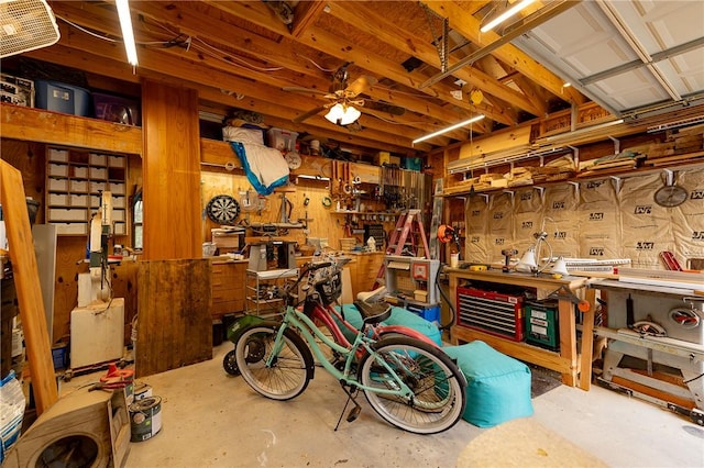 interior space with a workshop area and ceiling fan