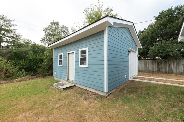 view of outdoor structure featuring a lawn