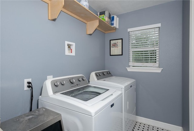 laundry area with separate washer and dryer