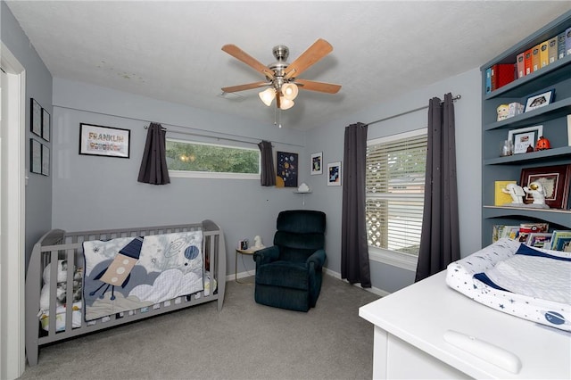 carpeted bedroom with ceiling fan