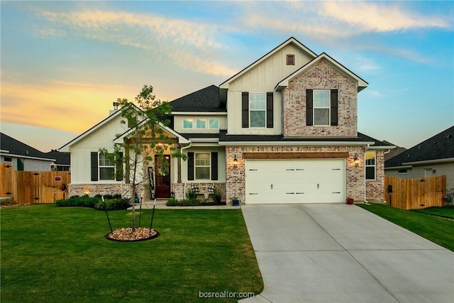 craftsman-style house with a garage and a lawn