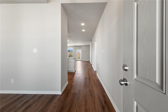 corridor featuring dark hardwood / wood-style floors