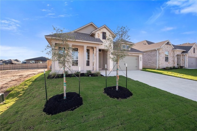 view of front of property featuring a front lawn and a garage