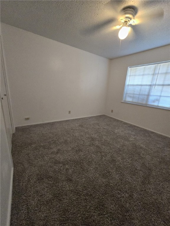 carpeted empty room with a textured ceiling and ceiling fan