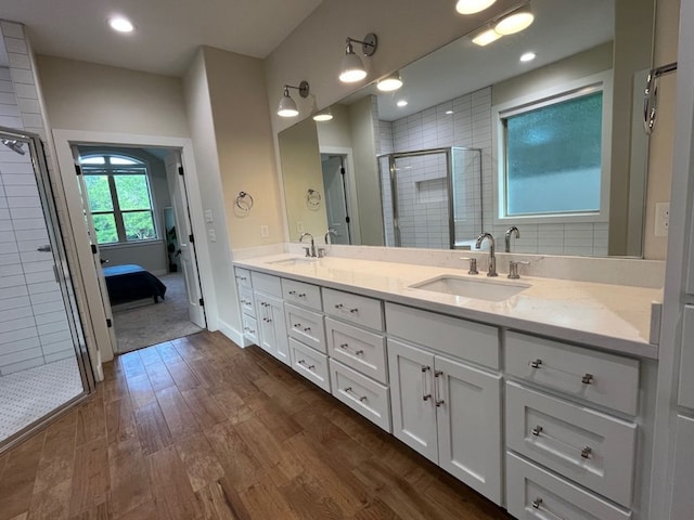 2016 R A Galindo Blvd, Bryan, TX 77807 - full bath with a stall shower, wood finished floors, double vanity, and ensuite bathroom
