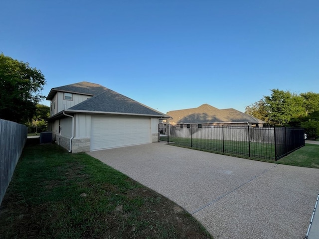 2016 R A Galindo Blvd, Bryan, TX 77807 - view of property exterior with driveway, roof with shingles, and an attached garage