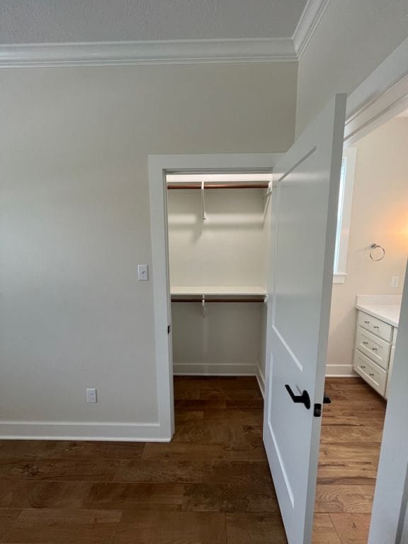 2016 R A Galindo Blvd, Bryan, TX 77807 - walk in closet featuring wood finished floors