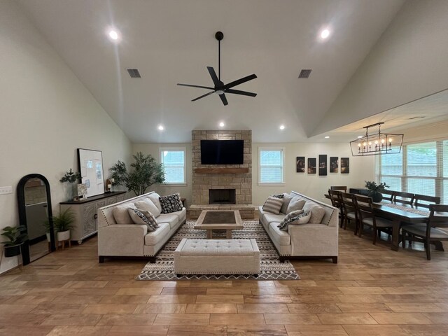 2016 R A Galindo Blvd, Bryan, TX 77807 - living area with wood finished floors, a ceiling fan, healthy amount of natural light, high vaulted ceiling, and a fireplace