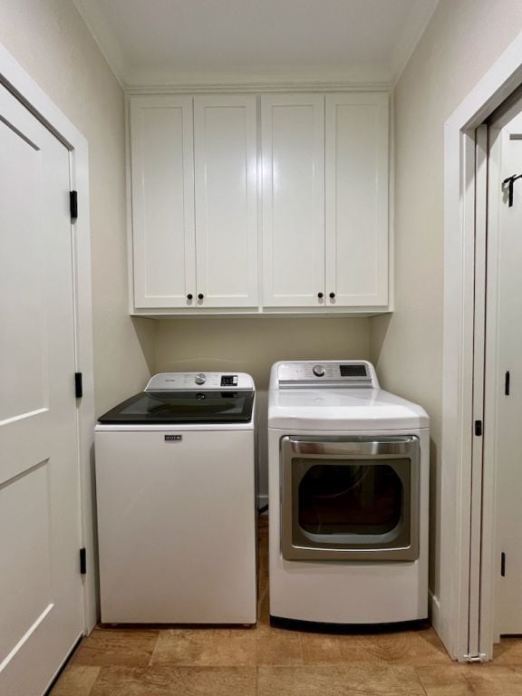 2016 R A Galindo Blvd, Bryan, TX 77807 - clothes washing area with separate washer and dryer and cabinet space